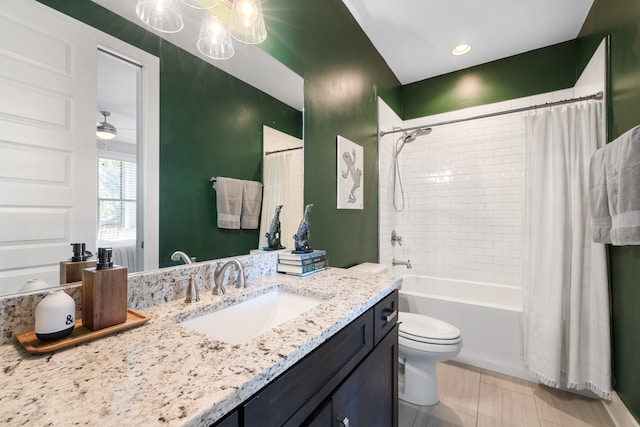 full bathroom featuring toilet, shower / bath combo with shower curtain, tile patterned floors, a notable chandelier, and vanity