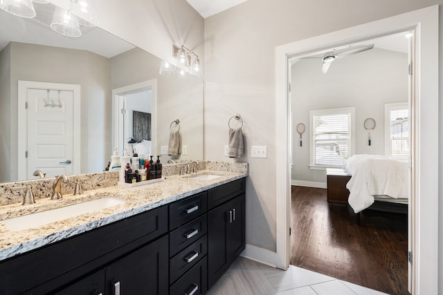 bathroom with vanity and hardwood / wood-style flooring