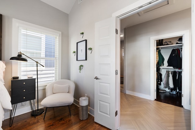 sitting room featuring dark hardwood / wood-style flooring