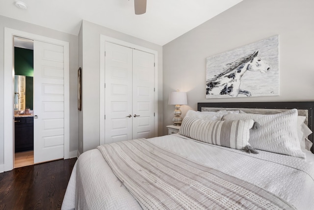 bedroom featuring ensuite bathroom, ceiling fan, and dark hardwood / wood-style floors