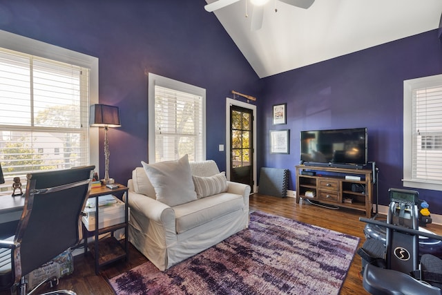 living room featuring ceiling fan, dark wood-type flooring, and high vaulted ceiling