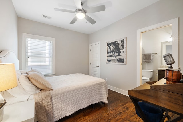 bedroom featuring ceiling fan, dark hardwood / wood-style floors, and ensuite bathroom