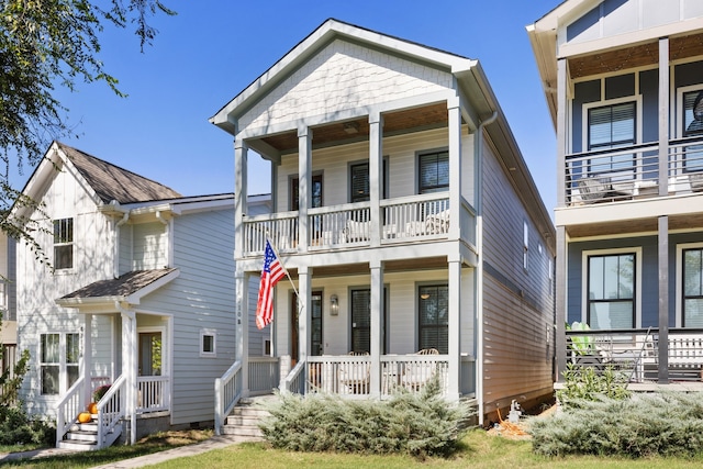 view of front facade featuring a balcony and a porch