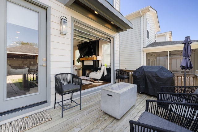 wooden deck featuring grilling area