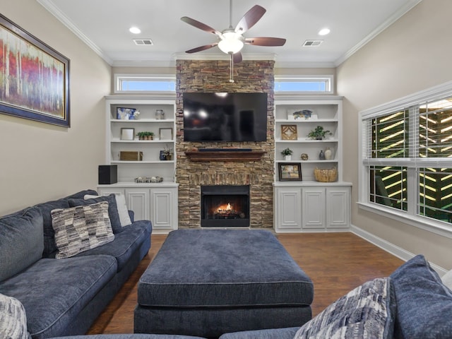 living room featuring plenty of natural light, crown molding, and dark hardwood / wood-style flooring