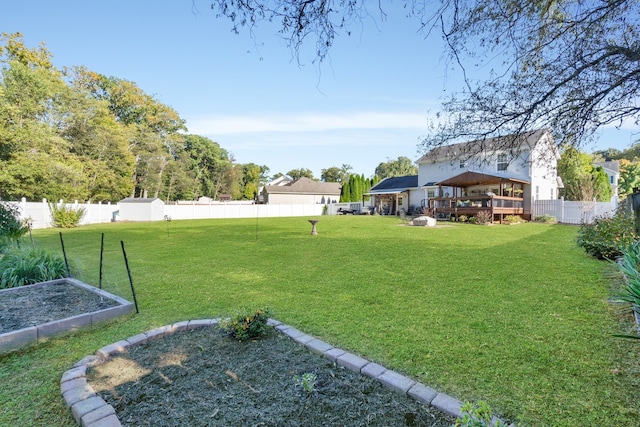 view of yard featuring a wooden deck