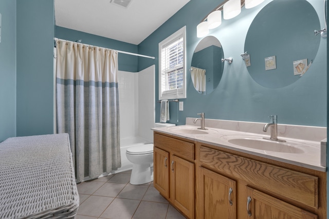 full bathroom with tile patterned flooring, shower / bath combo with shower curtain, toilet, and vanity