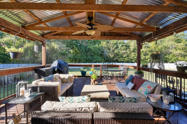 wooden terrace featuring an outdoor hangout area, a gazebo, ceiling fan, and grilling area