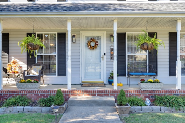 doorway to property with a porch