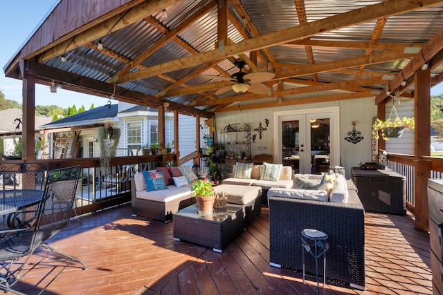 wooden terrace with outdoor lounge area, a gazebo, french doors, and ceiling fan