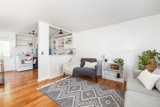 sitting room featuring ceiling fan and hardwood / wood-style flooring