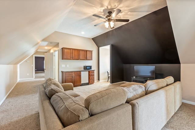 carpeted living room featuring lofted ceiling and ceiling fan