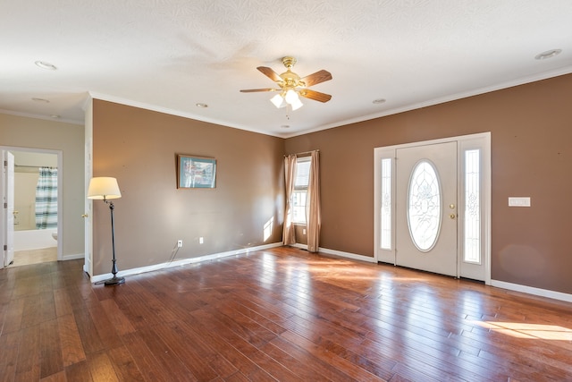 entryway with crown molding, a textured ceiling, dark hardwood / wood-style flooring, and ceiling fan