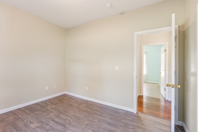 unfurnished room featuring hardwood / wood-style floors