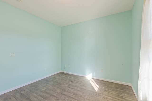 empty room with light hardwood / wood-style flooring