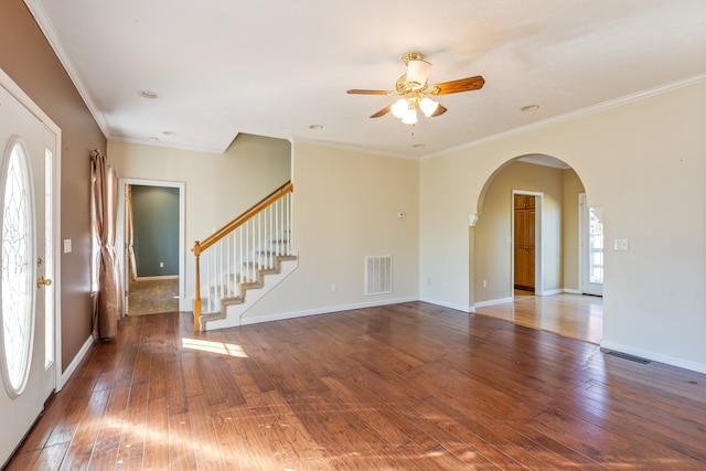 empty room with ornamental molding, hardwood / wood-style floors, and ceiling fan