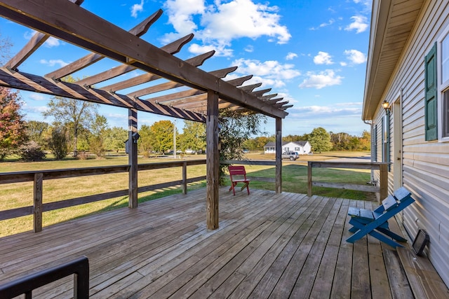 wooden terrace featuring a yard and a pergola