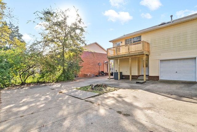 back of property featuring a garage