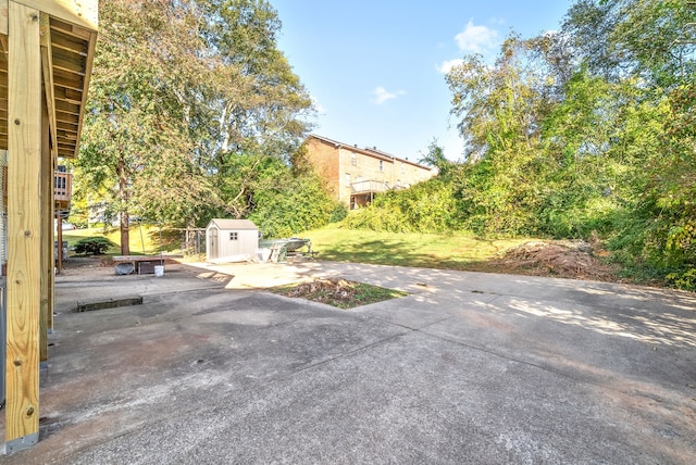 view of patio / terrace featuring a storage shed