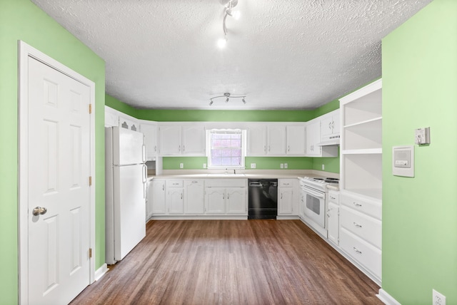 kitchen featuring white cabinetry, a textured ceiling, hardwood / wood-style floors, and white appliances