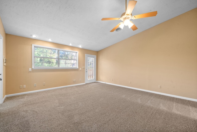 unfurnished room with a textured ceiling, carpet flooring, and ceiling fan