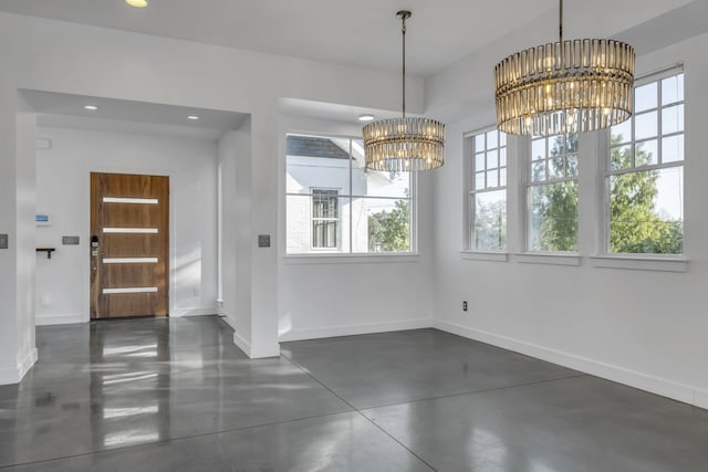 unfurnished dining area with a notable chandelier