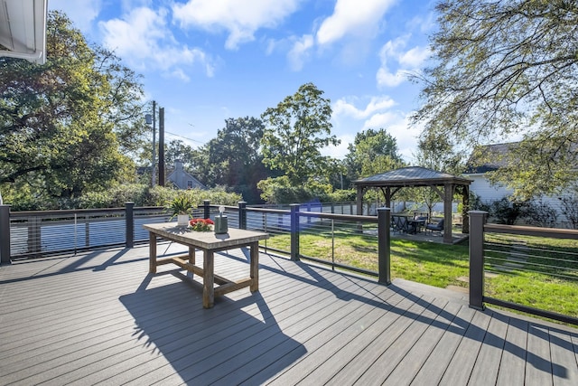 wooden deck with a gazebo and a yard