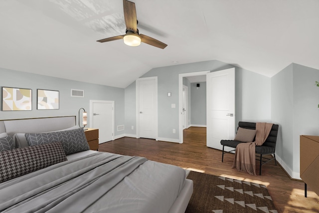 bedroom featuring lofted ceiling, dark hardwood / wood-style flooring, and ceiling fan