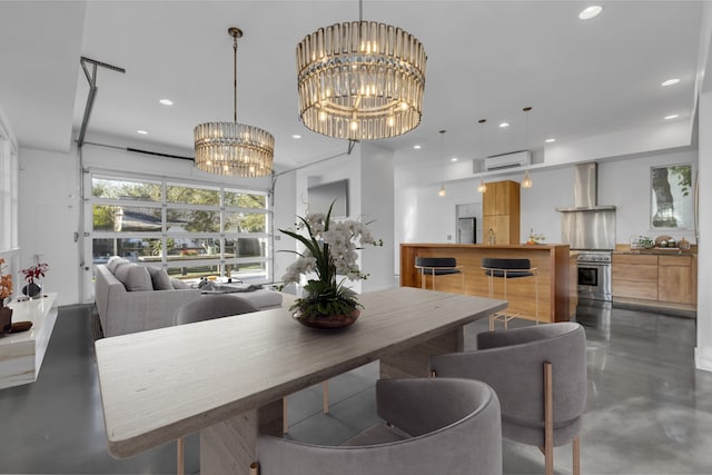 dining room with a wall mounted air conditioner and an inviting chandelier