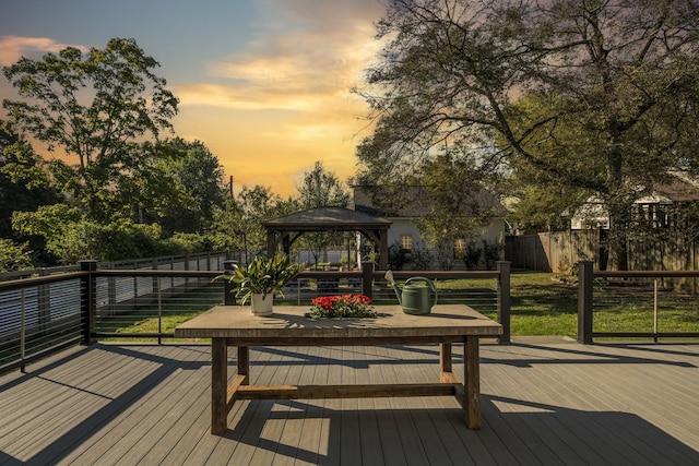 deck at dusk with a gazebo