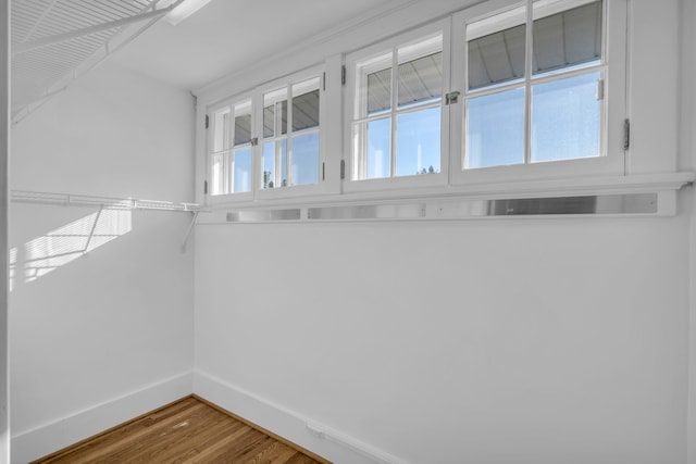 spacious closet featuring hardwood / wood-style flooring