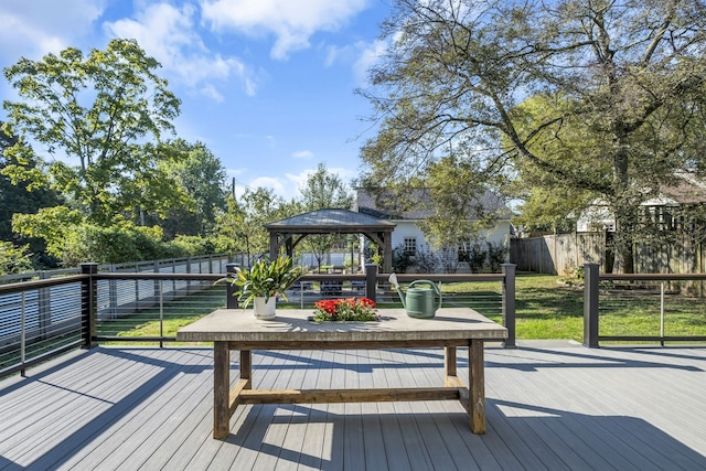 deck with a gazebo and a yard