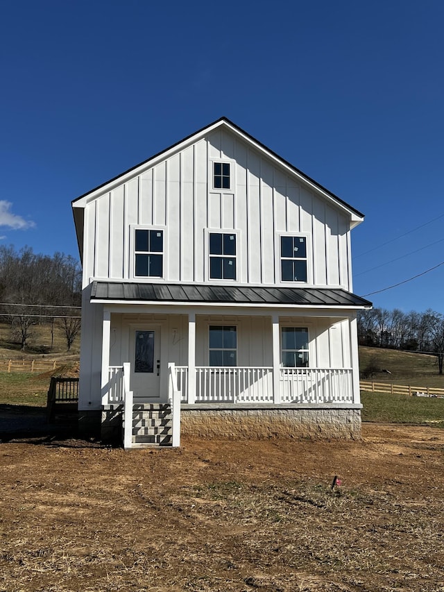 modern farmhouse style home with a porch