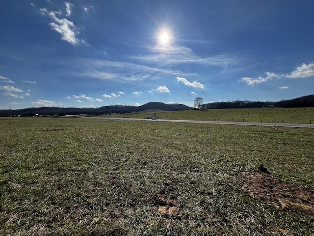 view of mountain feature with a rural view