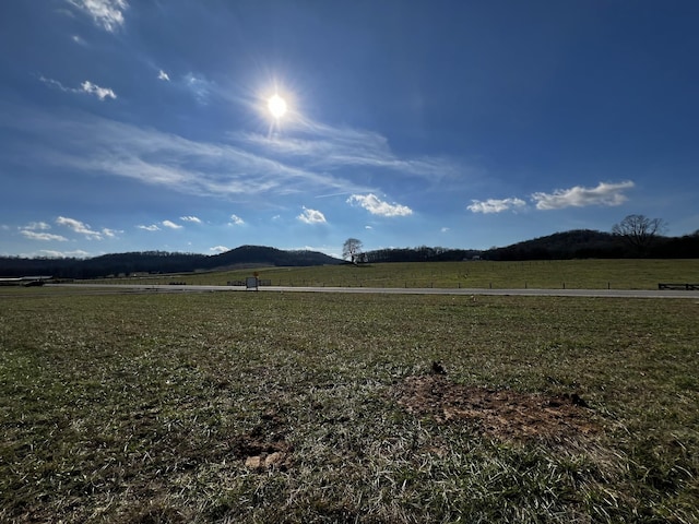 view of mountain feature with a rural view