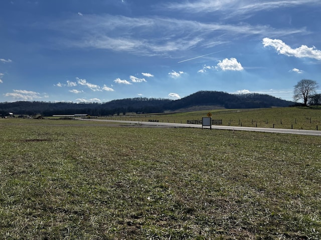 view of mountain feature with a rural view