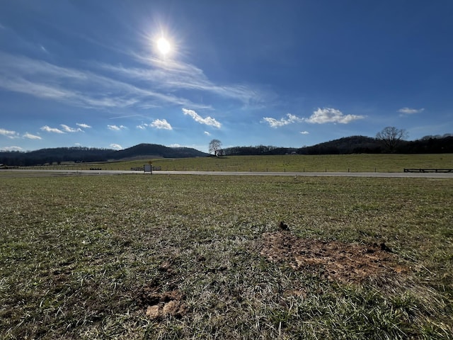 property view of mountains featuring a rural view