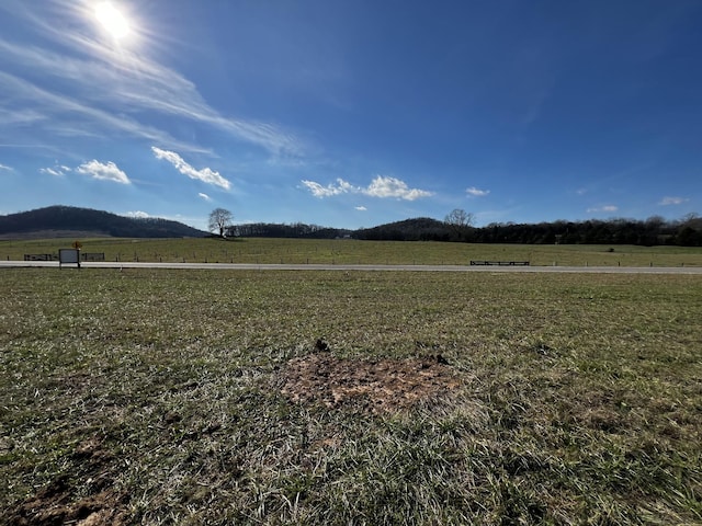 property view of mountains featuring a rural view