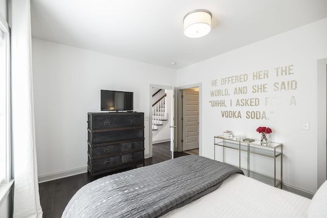 bedroom with dark wood-type flooring