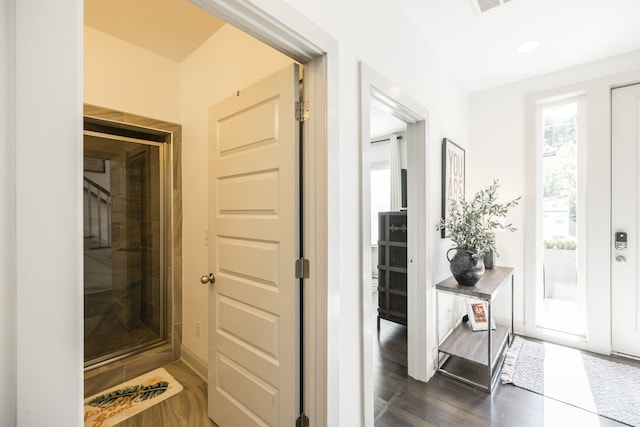 hallway featuring dark hardwood / wood-style floors