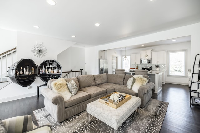 living room featuring dark wood-type flooring