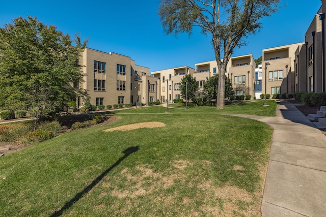 view of home's community with a yard