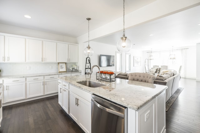 kitchen with sink, white cabinetry, and stainless steel dishwasher