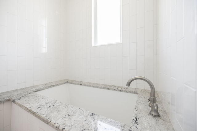 bathroom featuring a tub to relax in