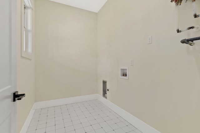 laundry area featuring light tile patterned floors and hookup for a washing machine