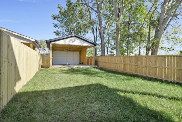 view of yard with a garage and an outdoor structure