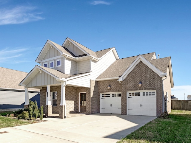 craftsman inspired home featuring covered porch and a garage