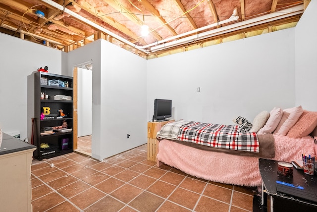 bedroom with dark tile patterned flooring