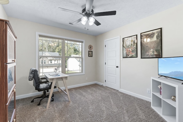 office with ceiling fan, carpet, and a textured ceiling