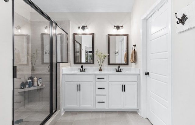 bathroom with vanity, tile patterned flooring, and an enclosed shower